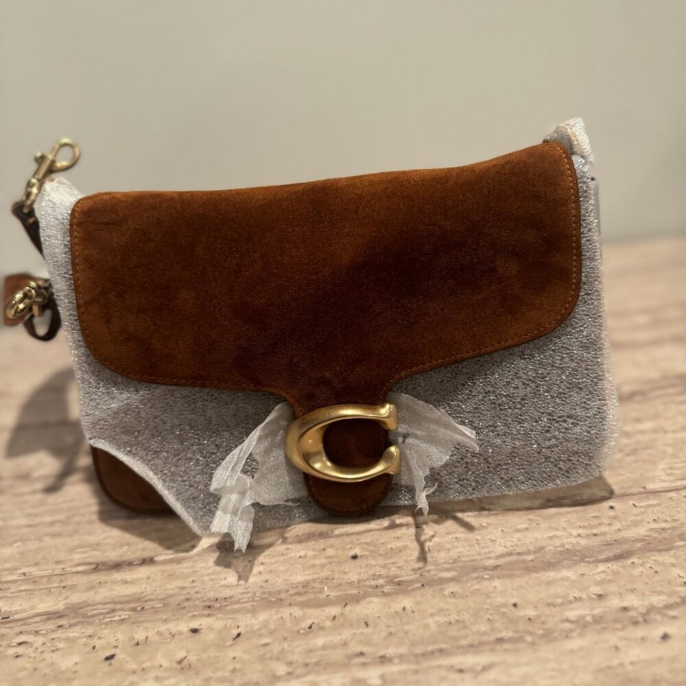 COACH Designed with a sophisticated BrassWarm Brown tabby